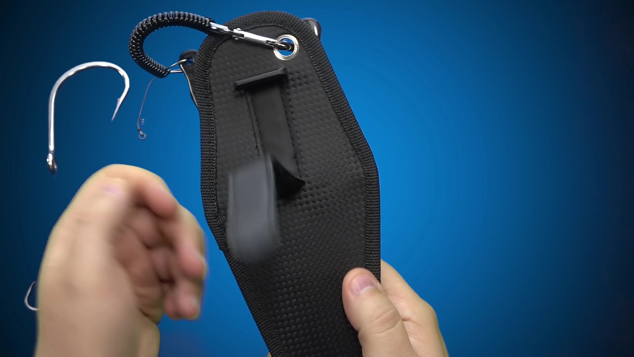 The reviewer holding the Sand-Like pliers, examining the finish.