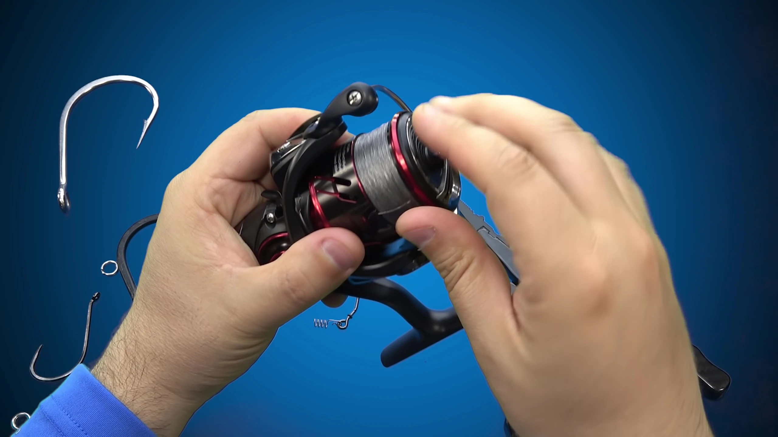 The reviewer attempting to cut braided line with the Sand-Like pliers.