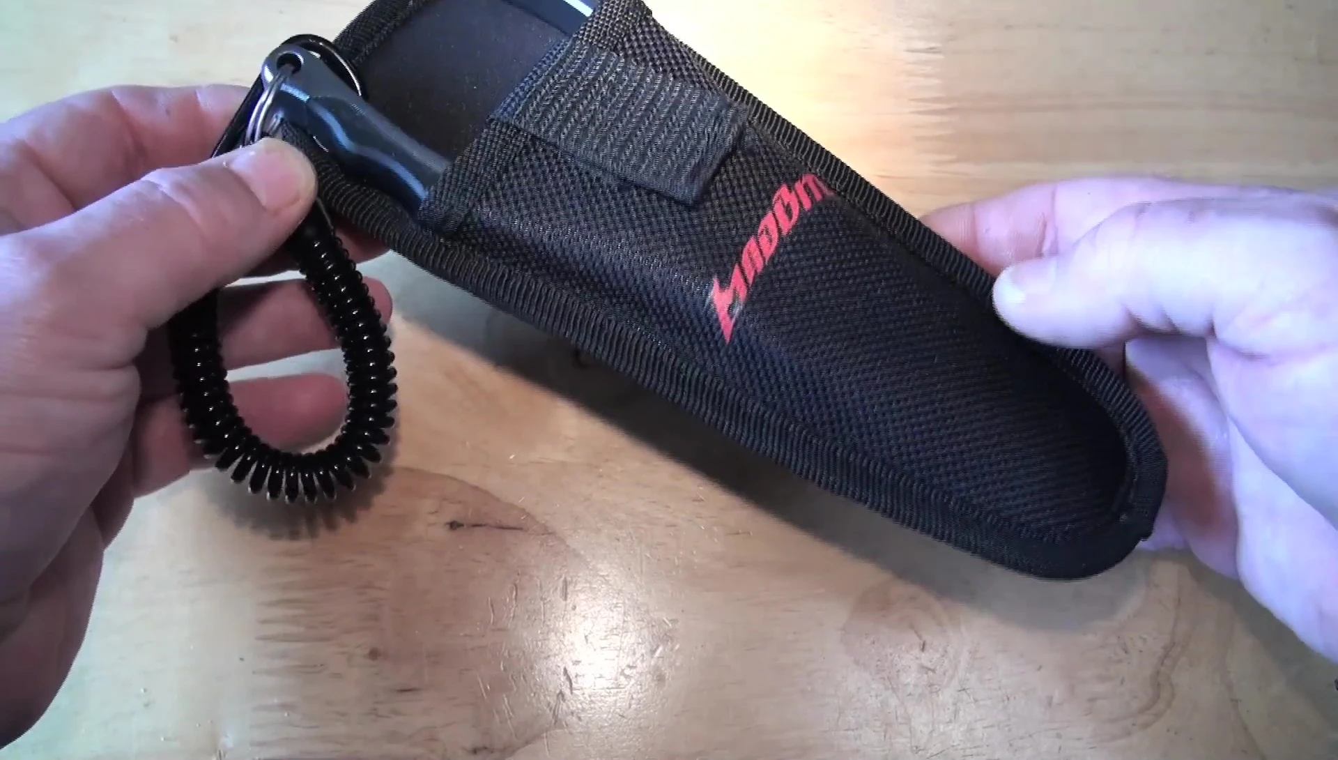 Close-up of the MadBite fishing pliers in their packaging