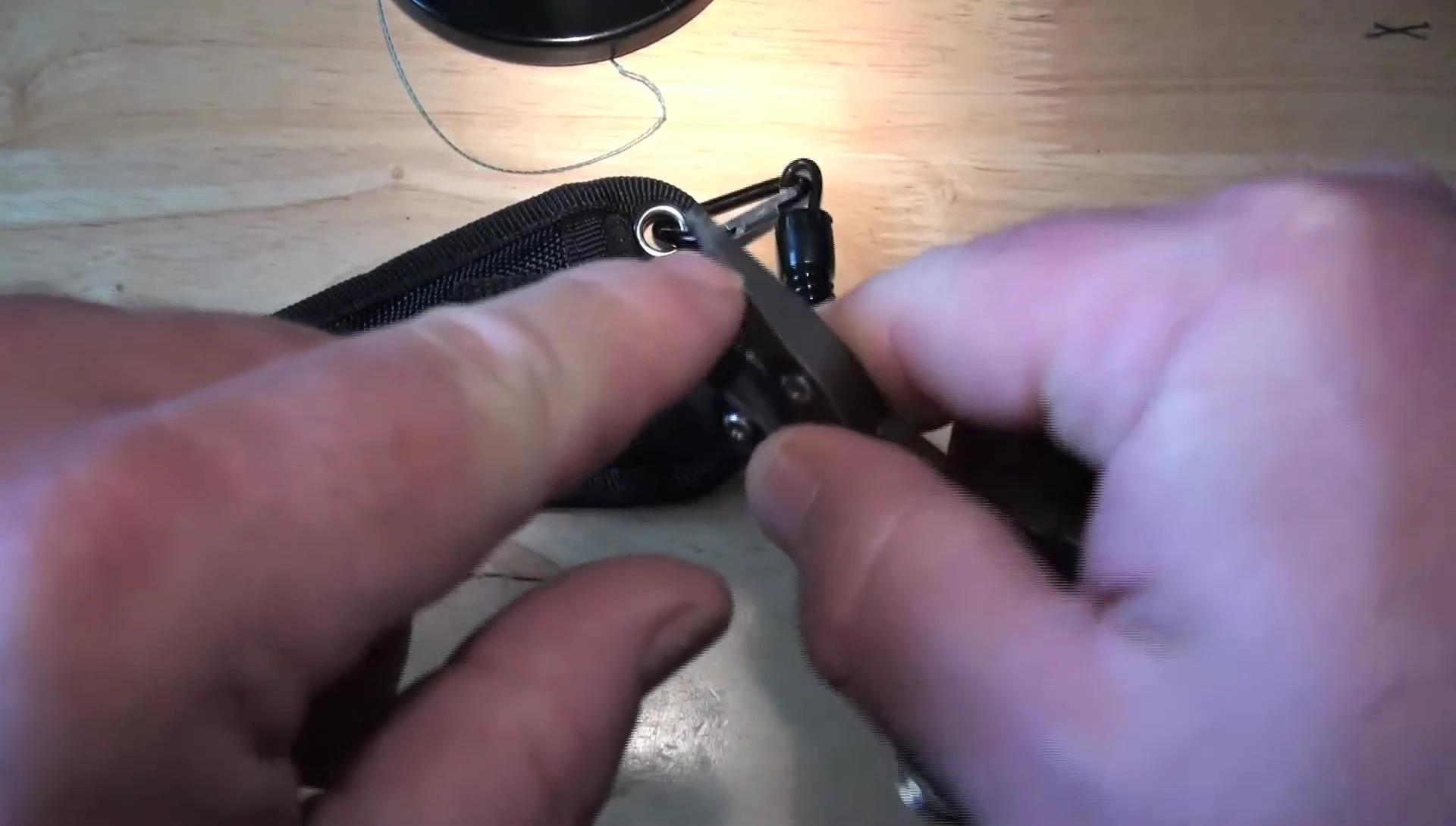 Close-up showing the bent jaws of the pliers after crimping