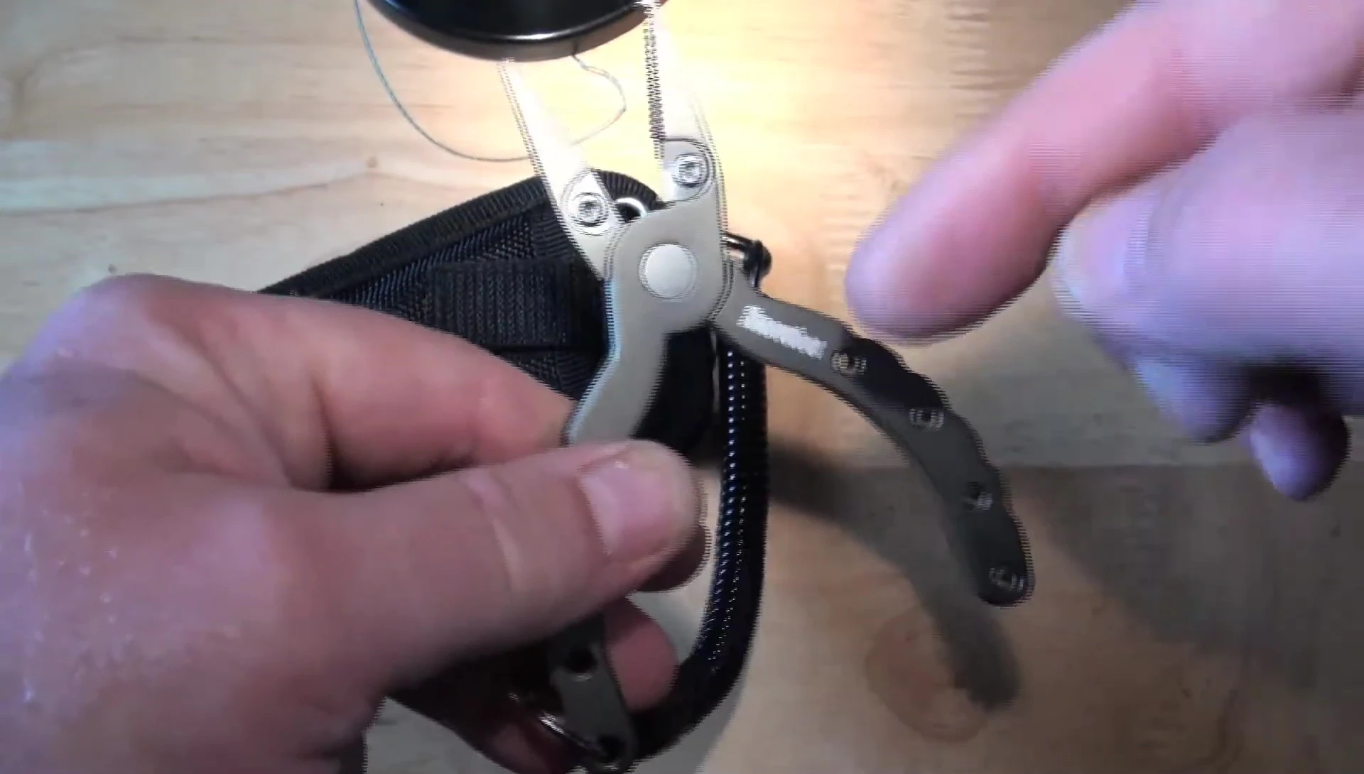Focus on the bent part of the pliers