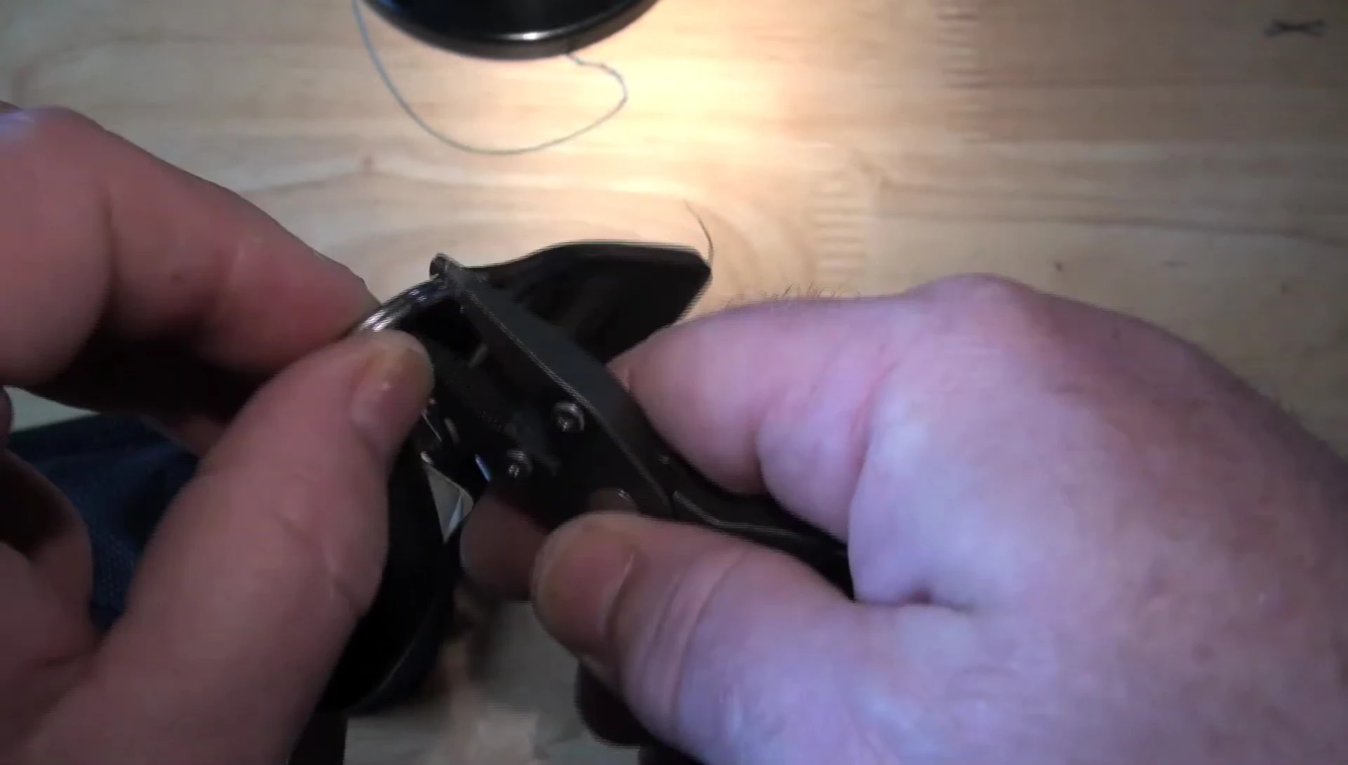 The reviewer using the split ring opener