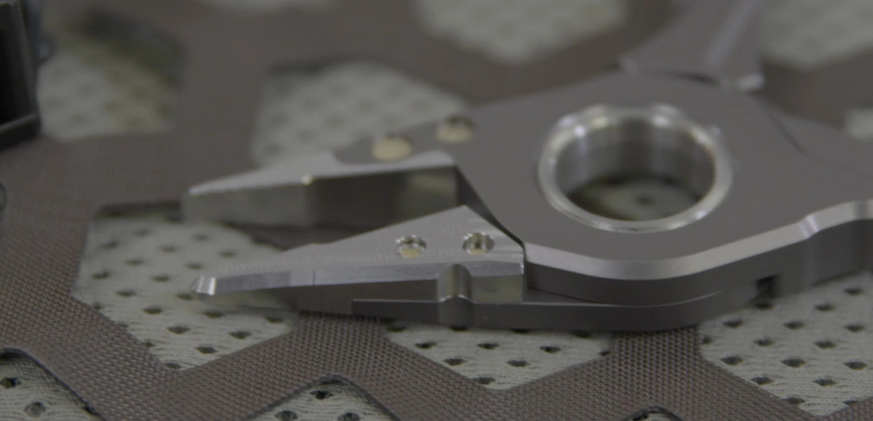 Close-up of the plier jaws, showing both the textured and smooth surfaces.