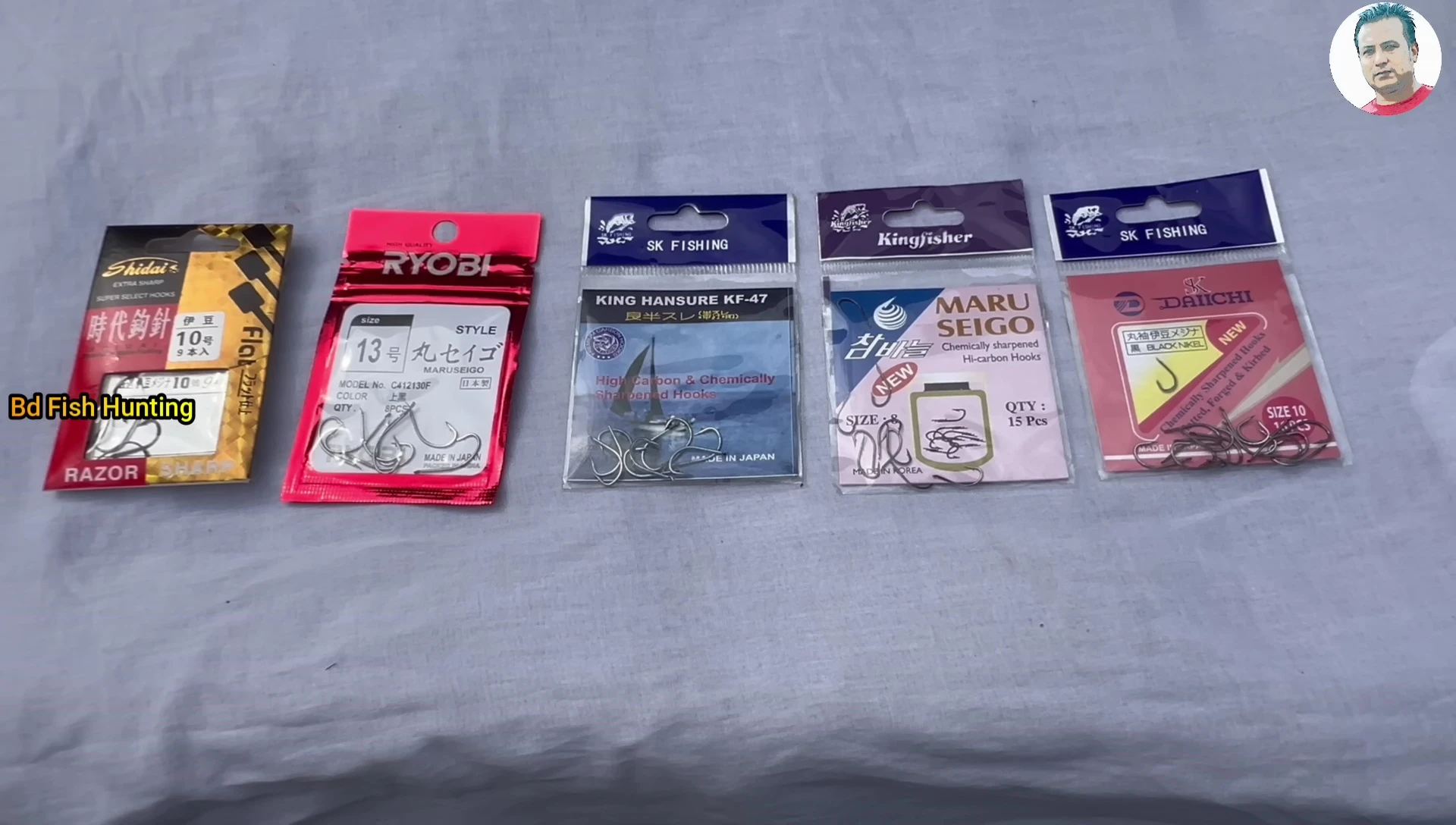 Various fishing spears displayed, showcasing different brands and sizes.