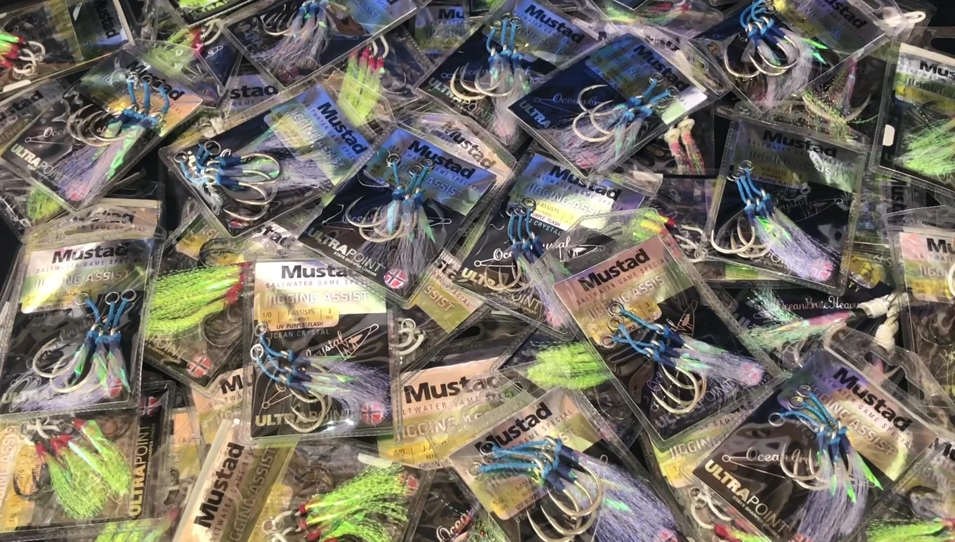 A selection of green and blue fishing hooks.