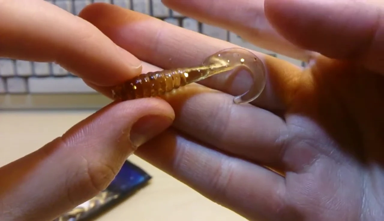 Close-up showcasing the glitter embedded within the worm bait.