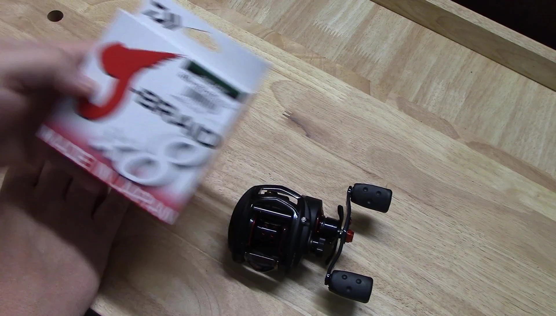The reviewer preparing to spool the reel with new line.