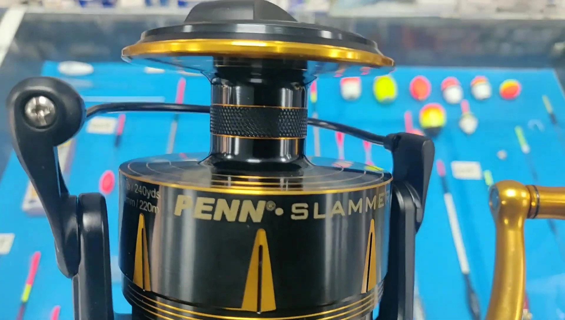 The reel's black and gold design and 'Slammer' branding
