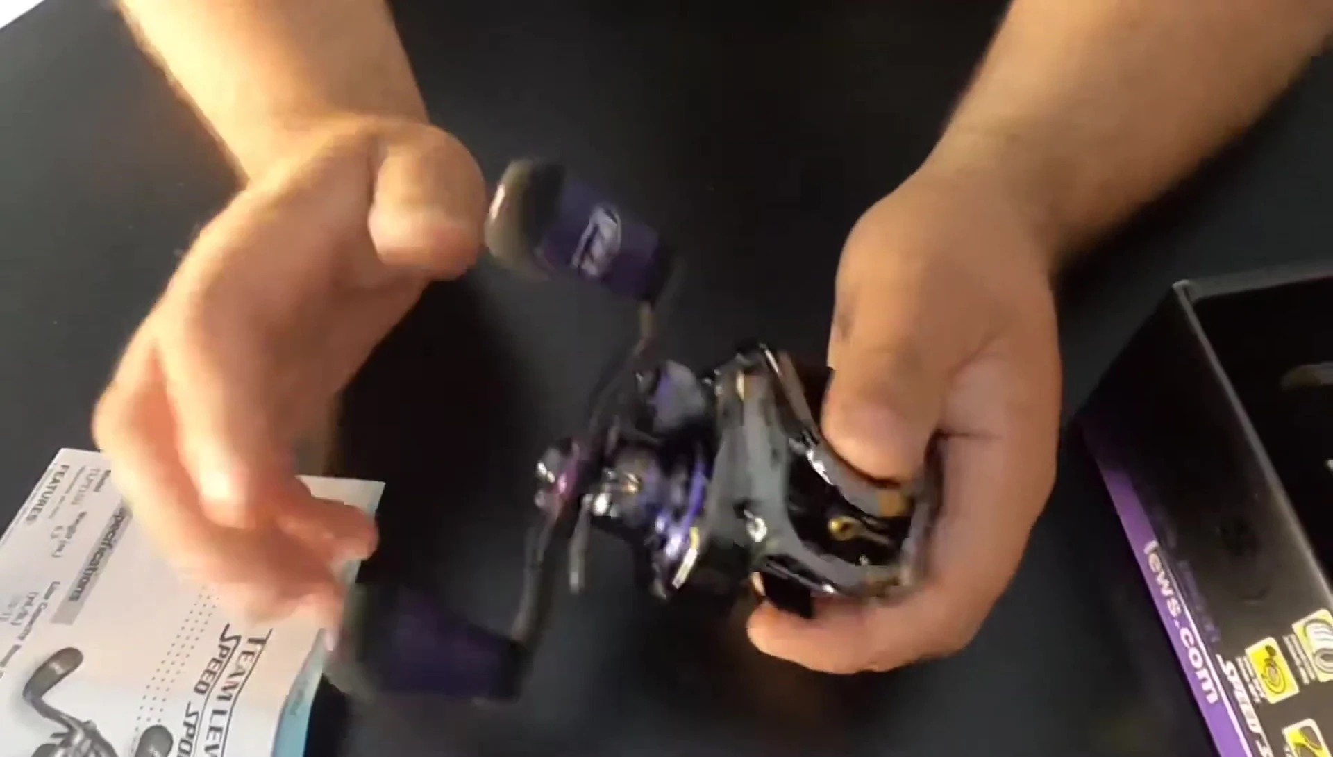 Close-up of the reel showcasing the large carbon fiber handle.