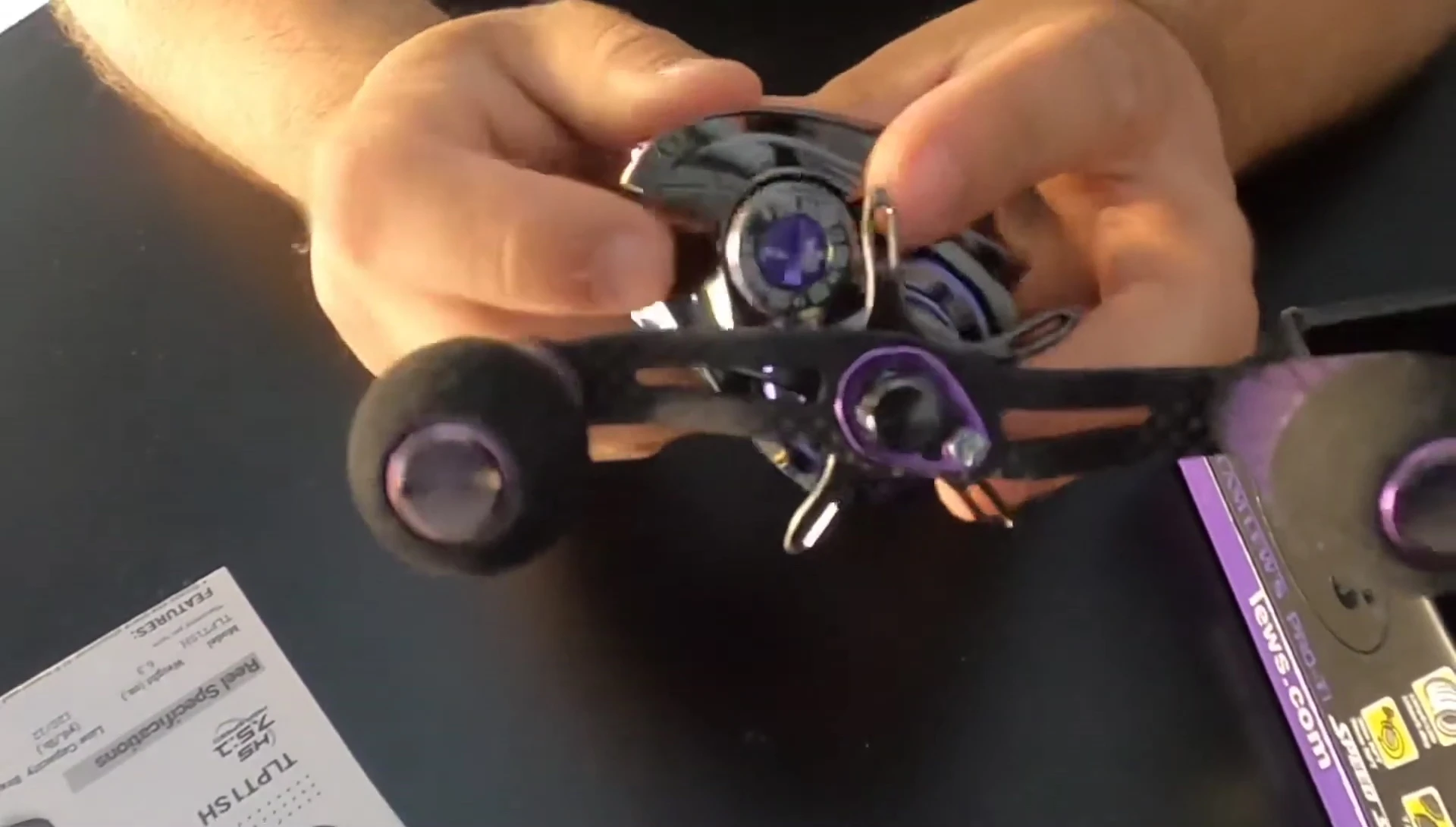 Close-up shot of the adjustable drag system and line capacity dial.