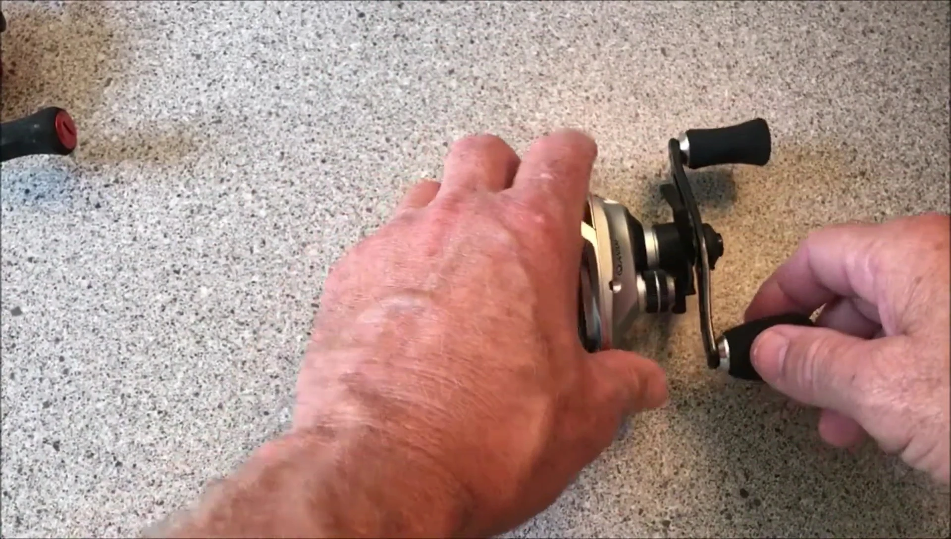 The speaker holding the reel.