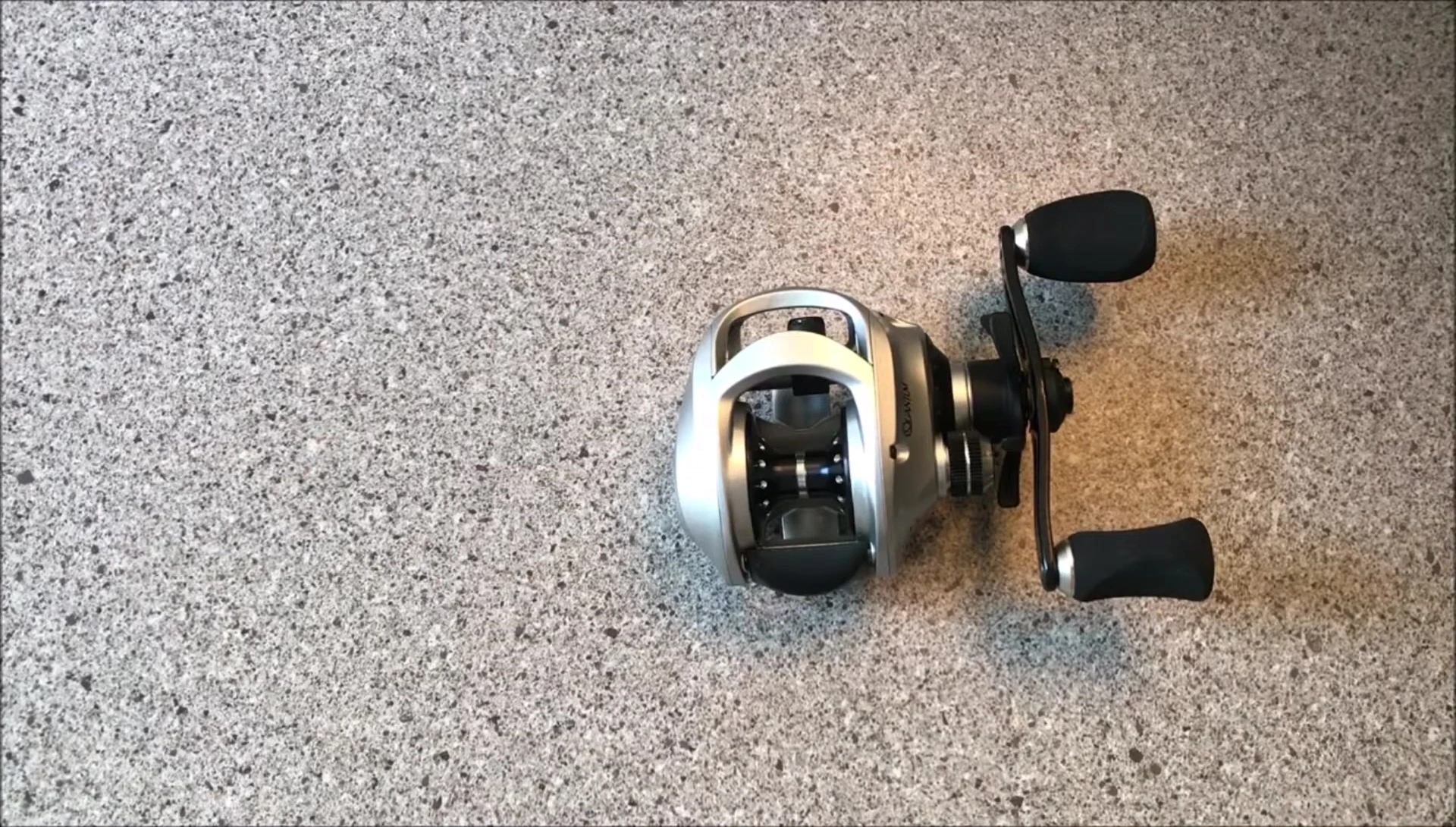 Close-up shot of the speaker's collection of Quantum Icon PT reels, showcasing their durability.