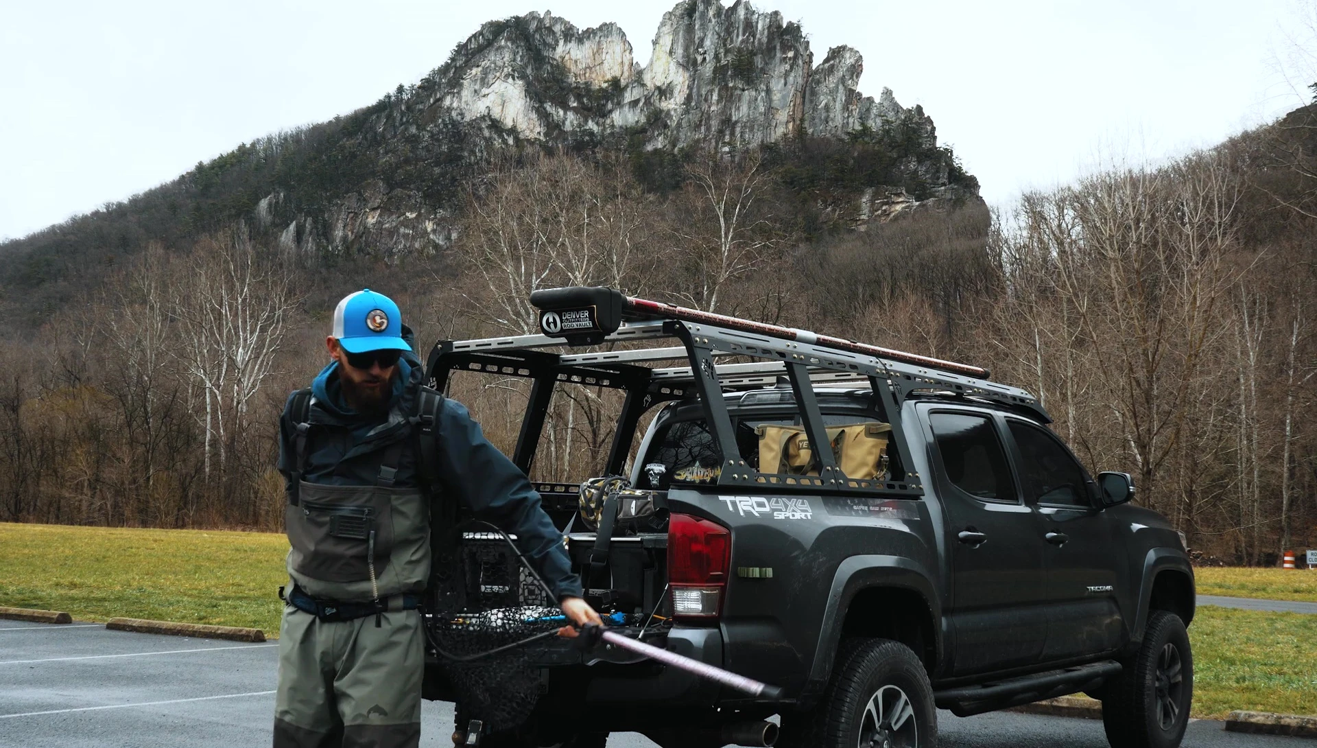 Carrying a large fishing net in a backpack with the hoop between the bag and back.