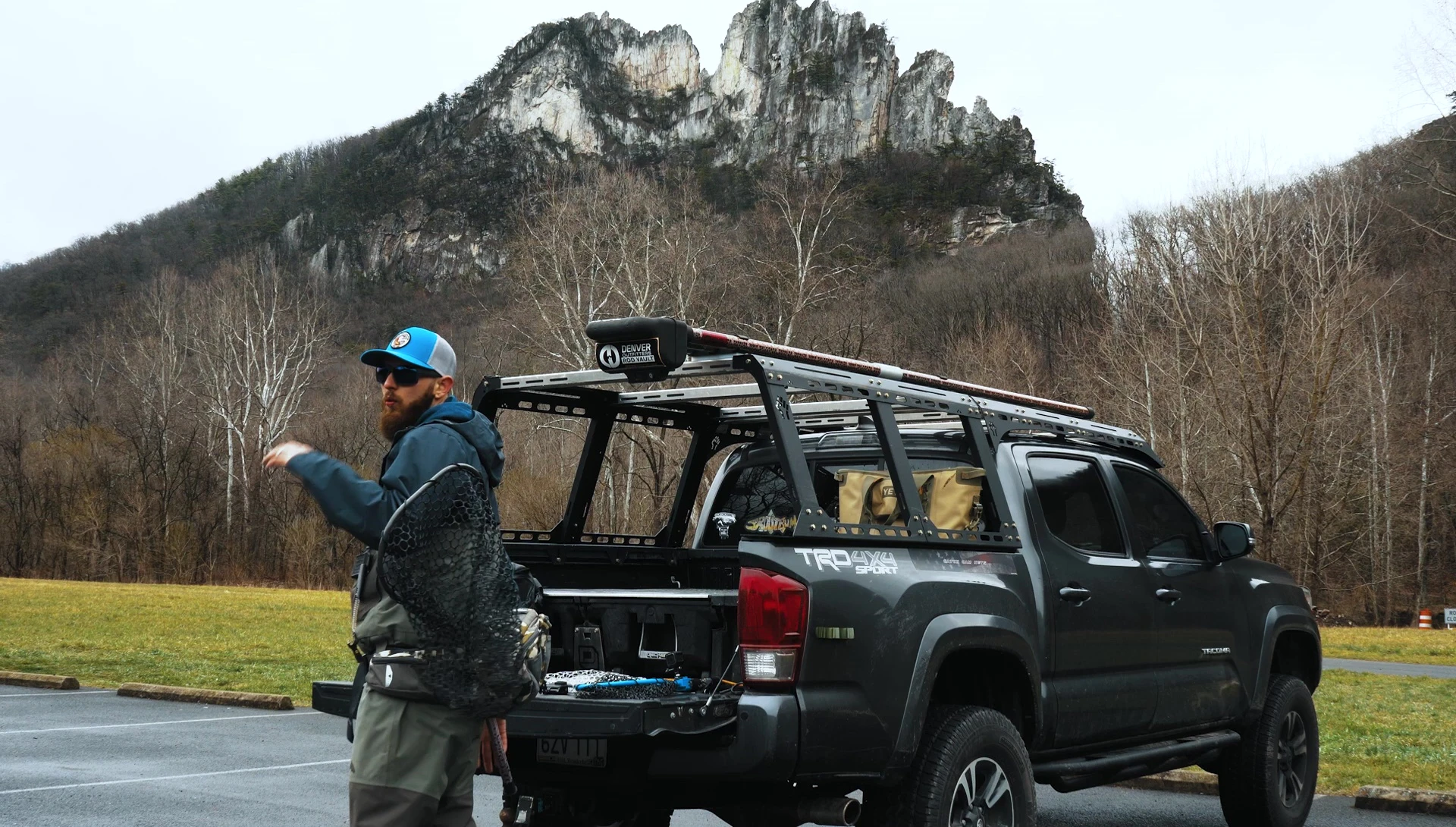 Sliding a large fishing net into a sling pack.