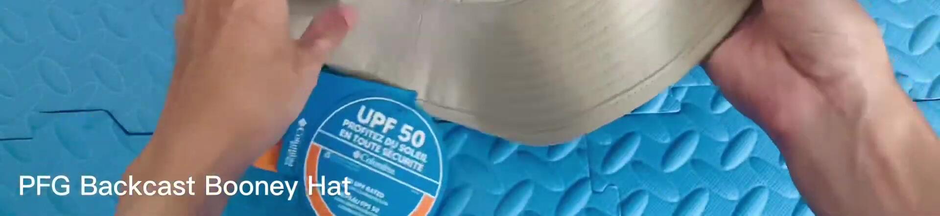 Text on the hat indicating UPF 50 protection.