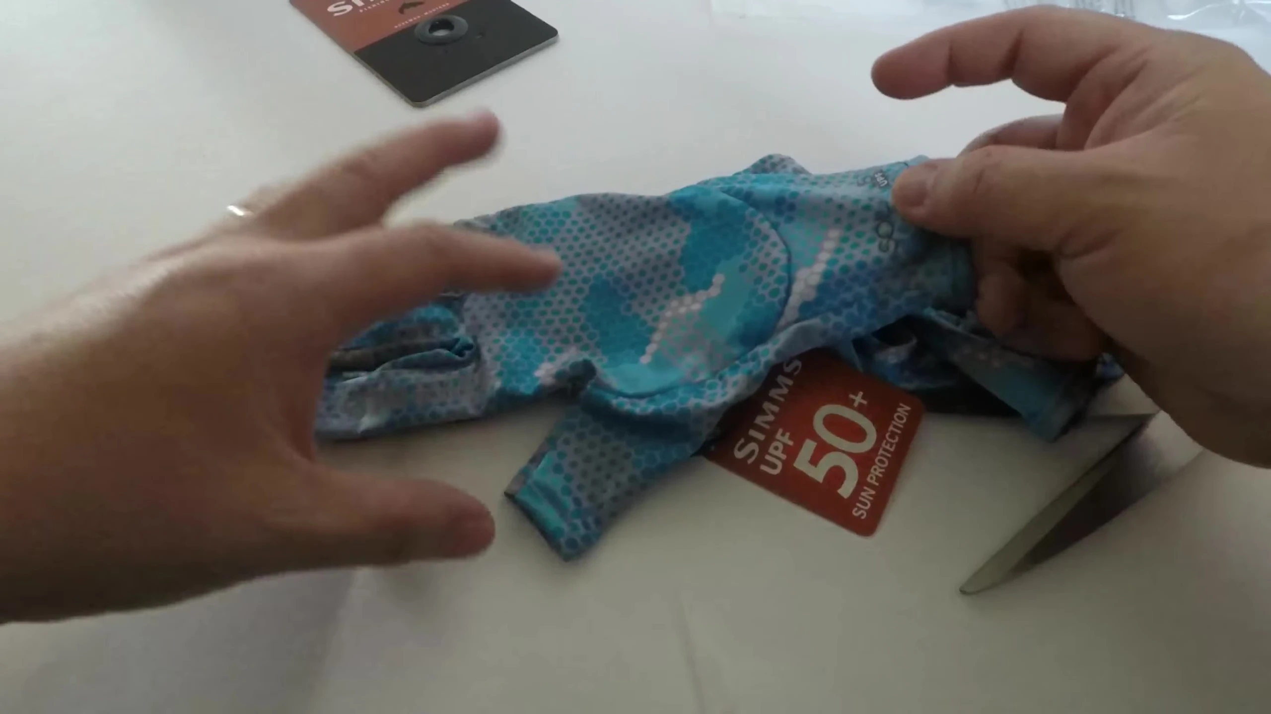 Close-up of the glove highlighting the 50+ UPF sun protection.