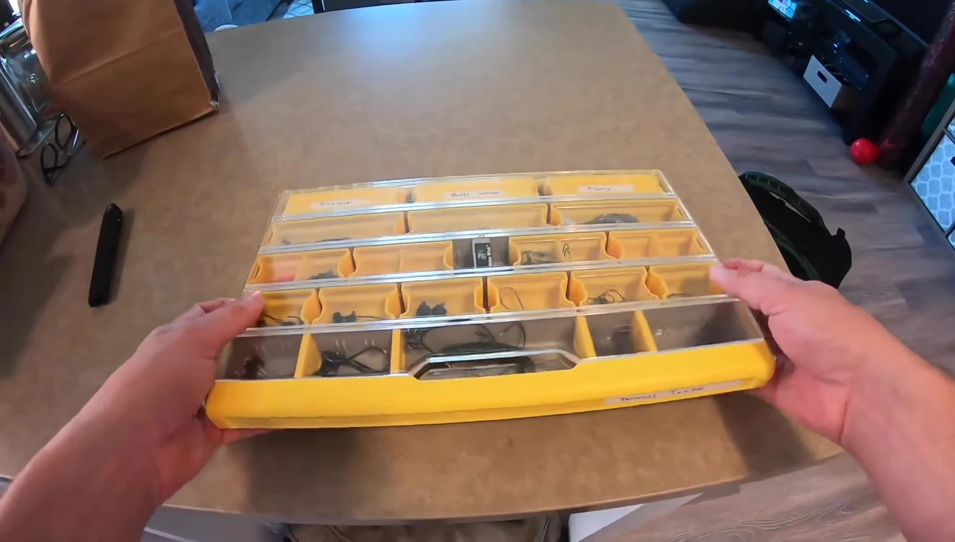Box shown fitting into backpack.