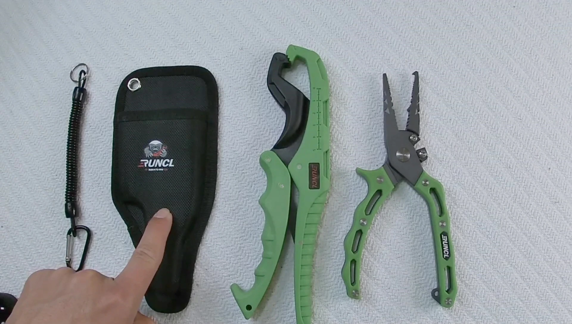 The reviewer holding the pliers