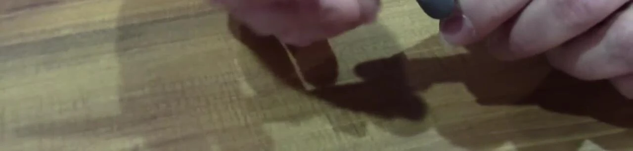 The presenter showing both sides of the Bait Knife's blade