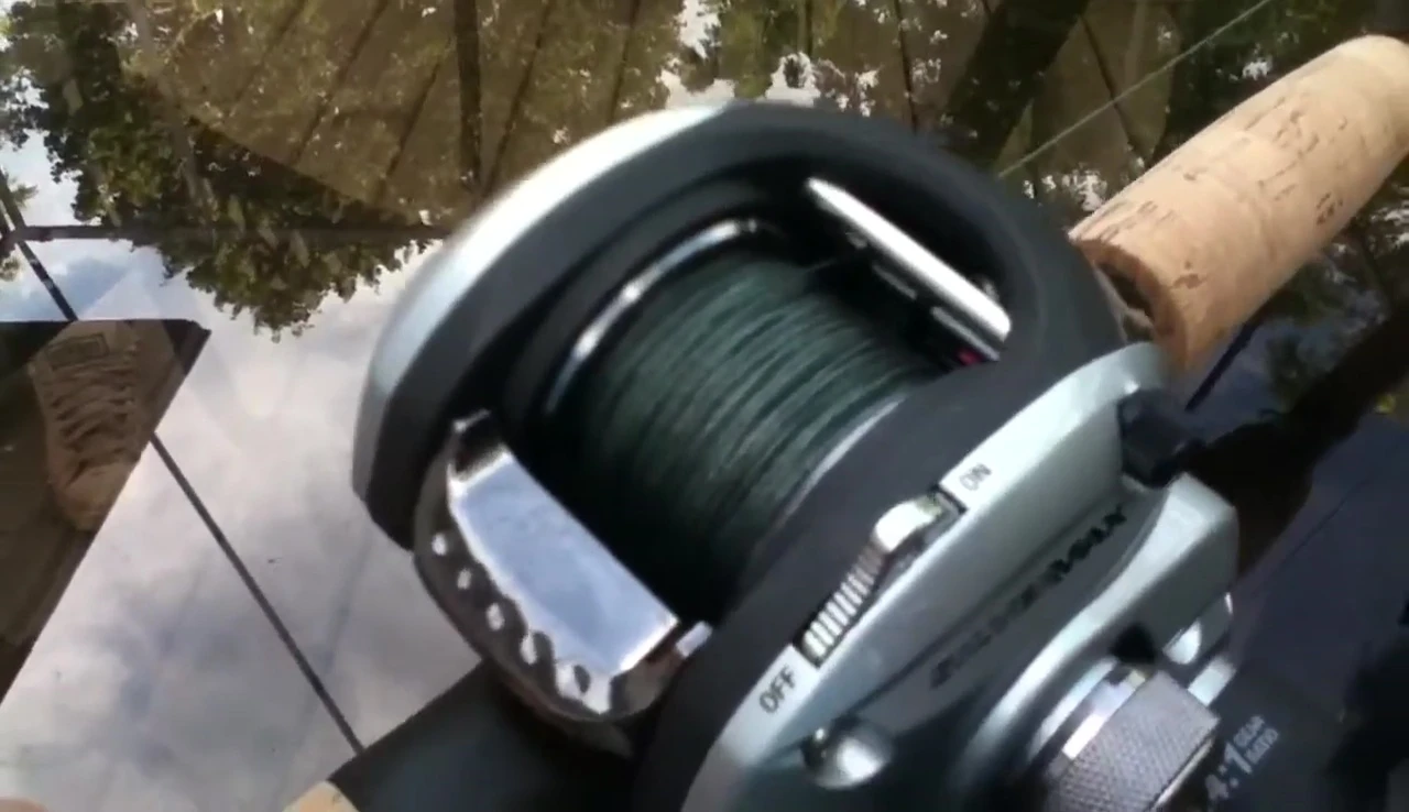 The flipping switch on the reel's side.