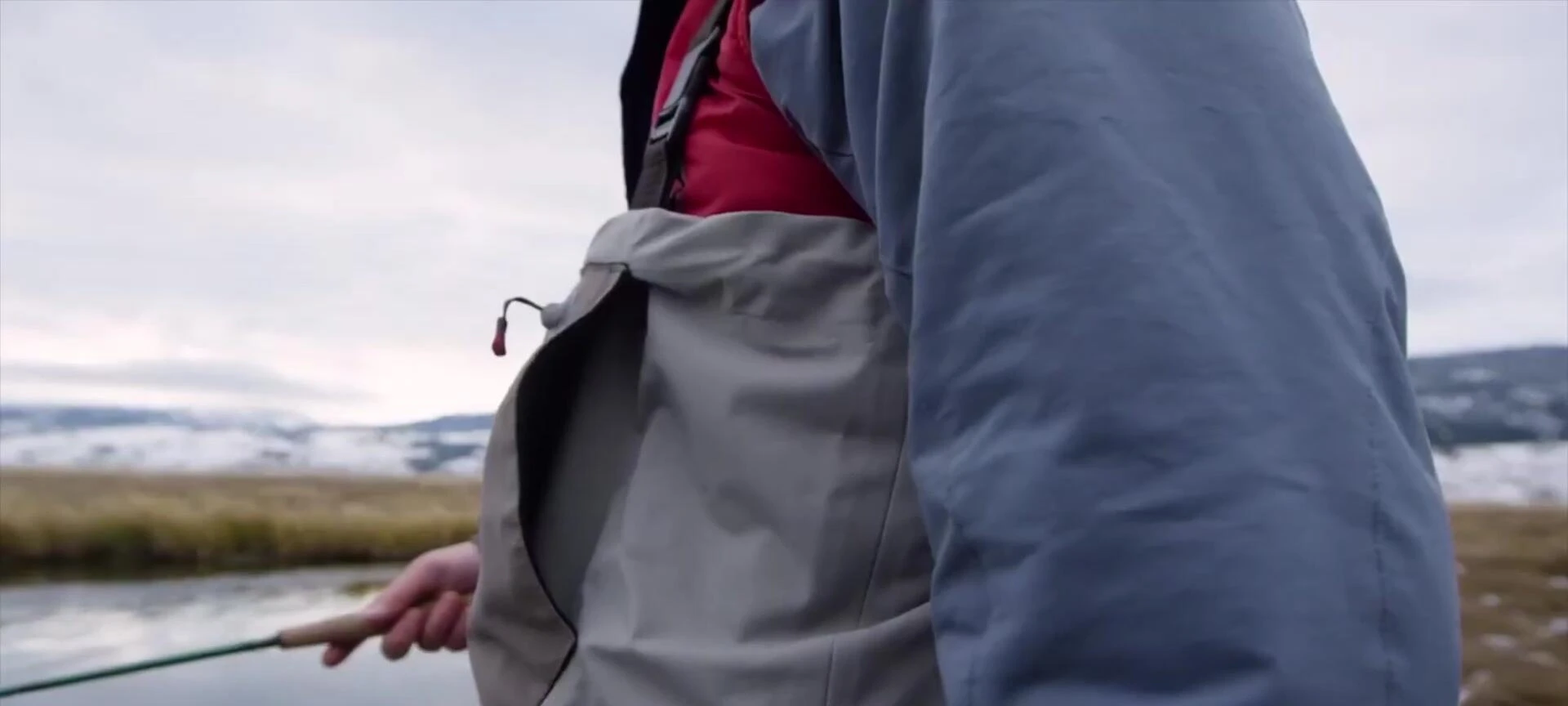 Close-up of the fleece-lined hand warmer pocket.