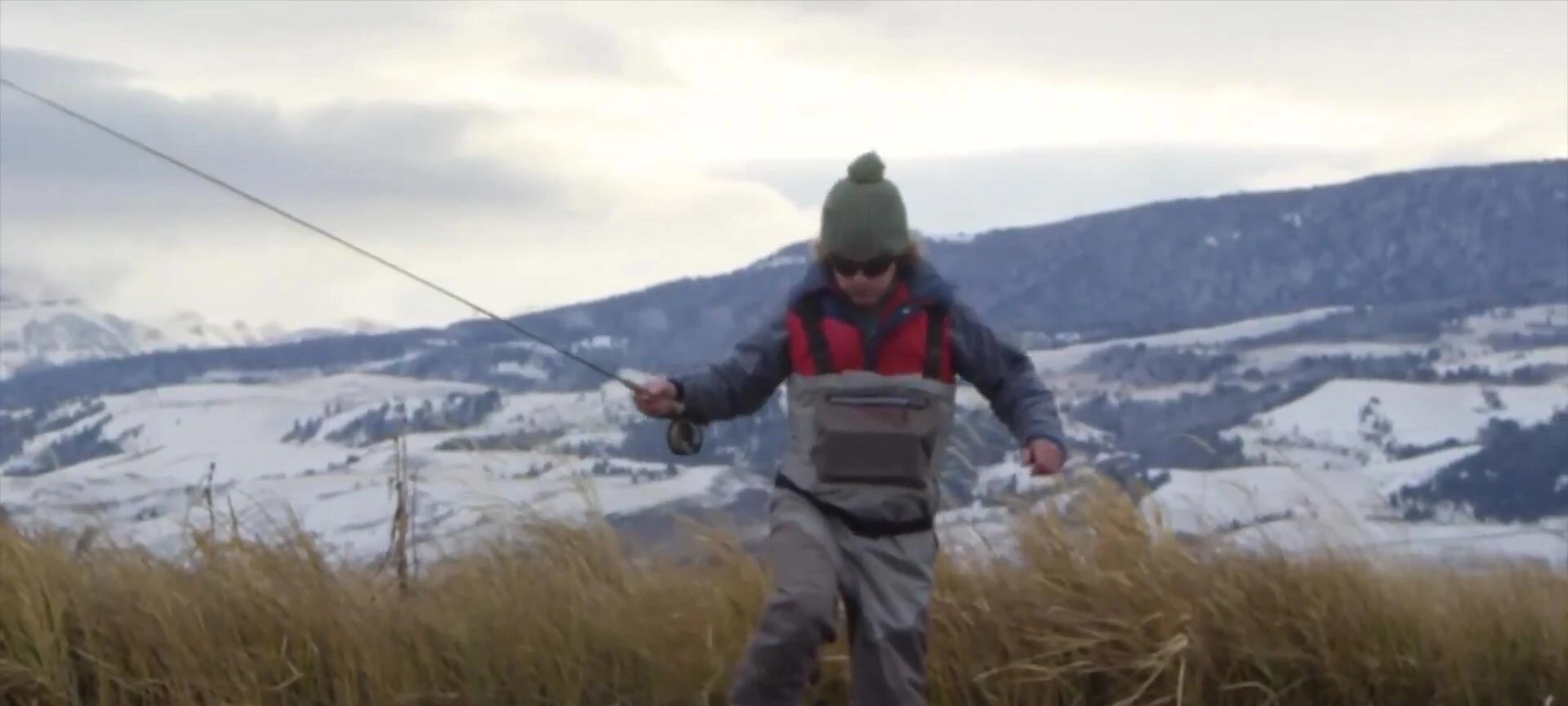 Person wearing the waders demonstrating flexibility and movement.