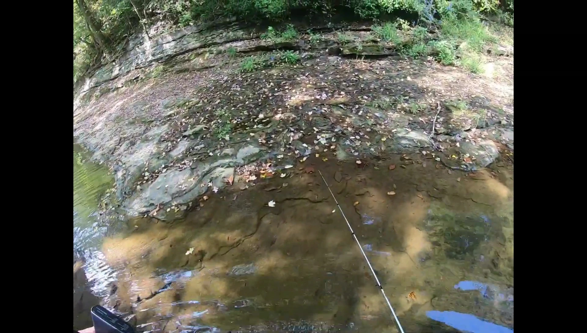 Walking on slick rocks, showing the boots' grip.