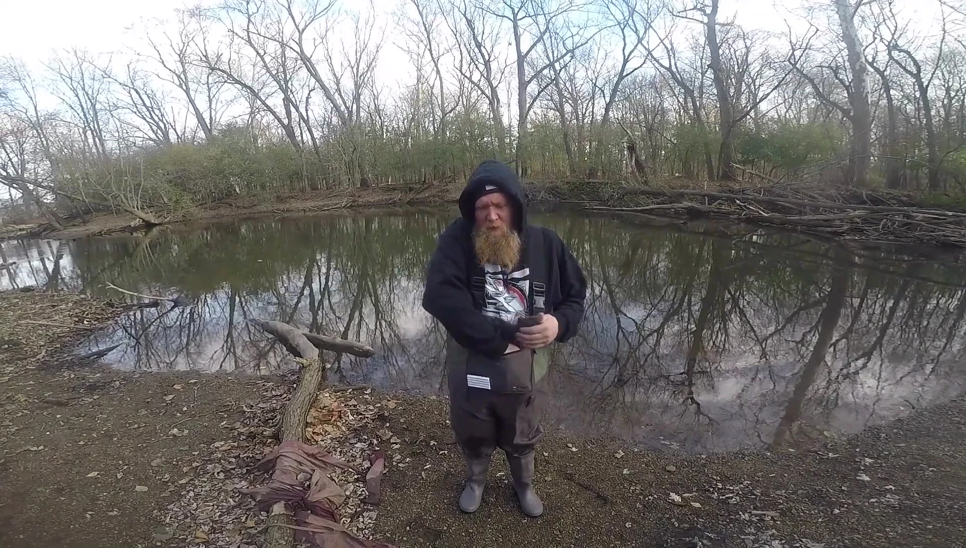 The reviewer demonstrating the pocket size.