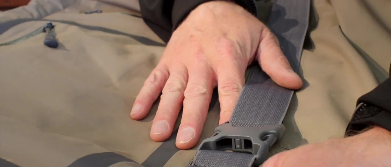 Showcase of the hand warmer pockets and chest pocket features.