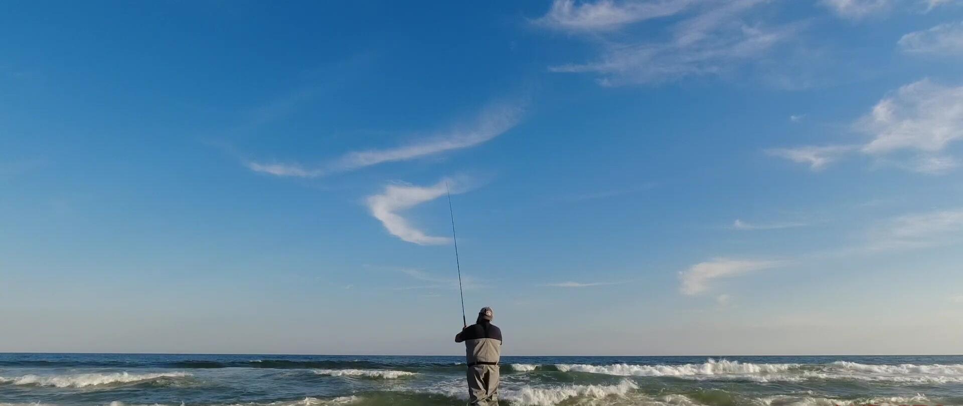 The reviewer wading into the water