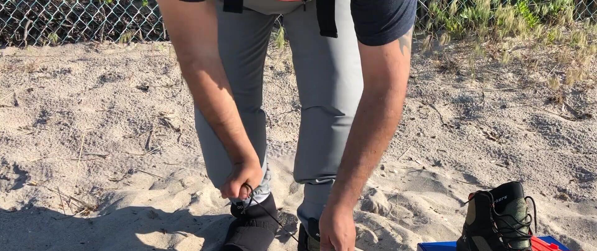 The reviewer putting on the boots