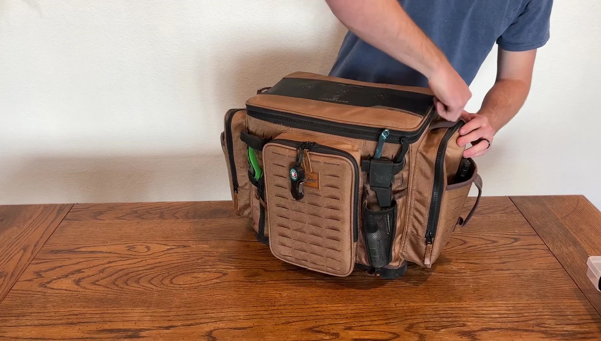 Opening the main compartment of the Plano 3700 XL Tackle Bag.