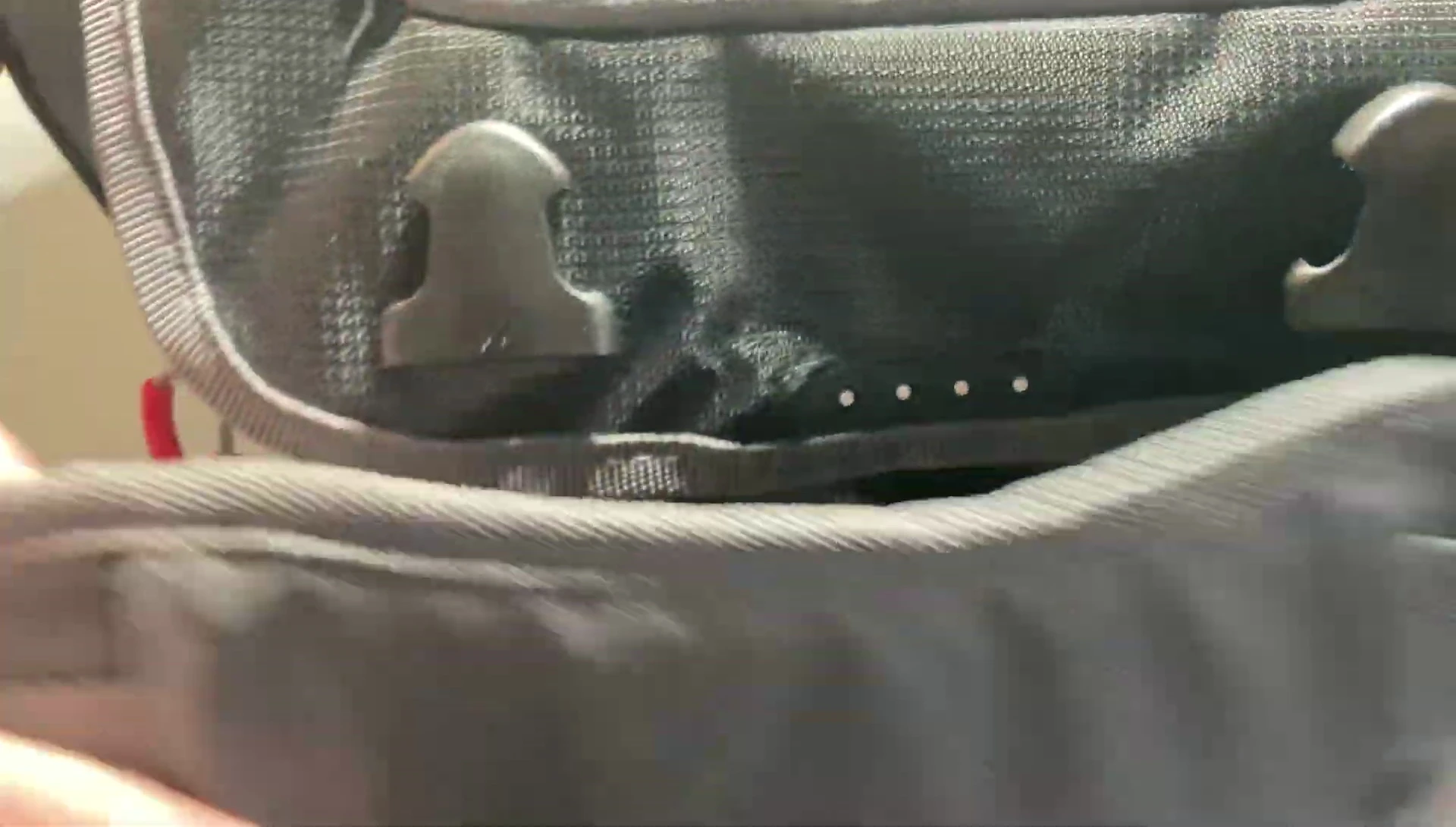 Shot of the shoulder strap and the plier holder.
