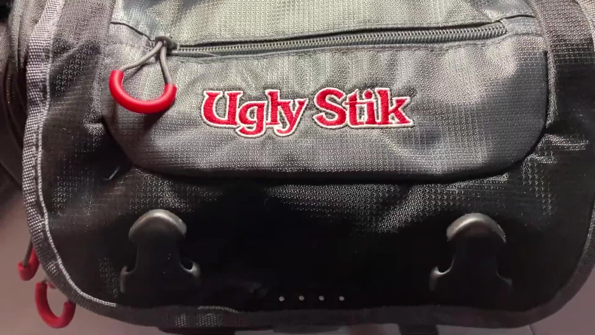 Close-up of Junie holding the Ugly Stik tackle bag.