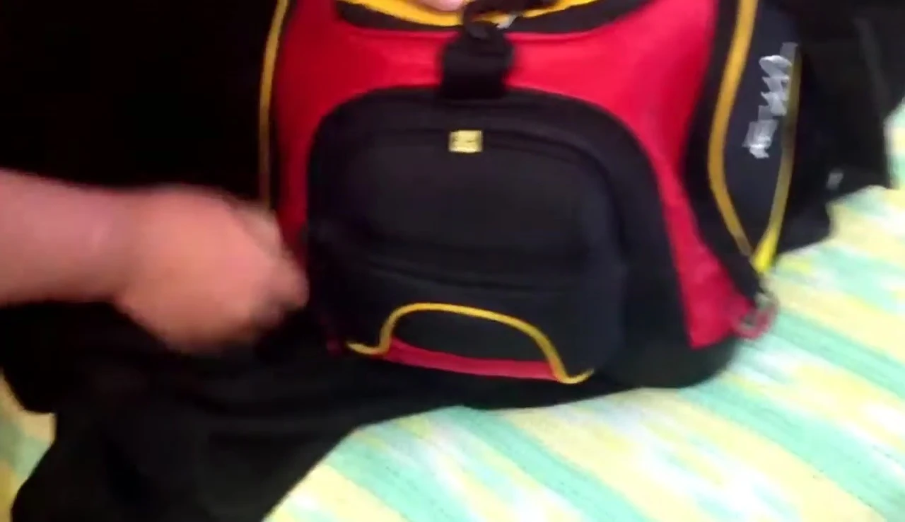The angler showing the side pocket used for smaller bobbers.