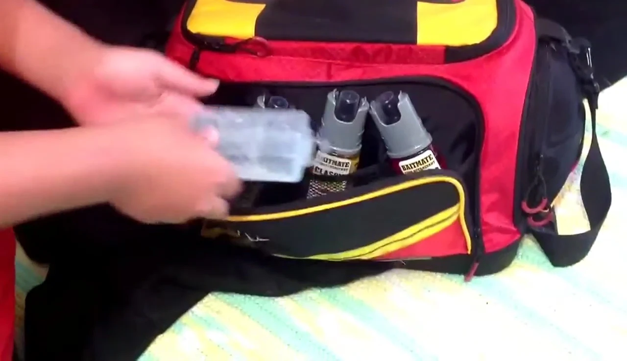 A view of the back pocket containing attractants, sinkers, and swivels.
