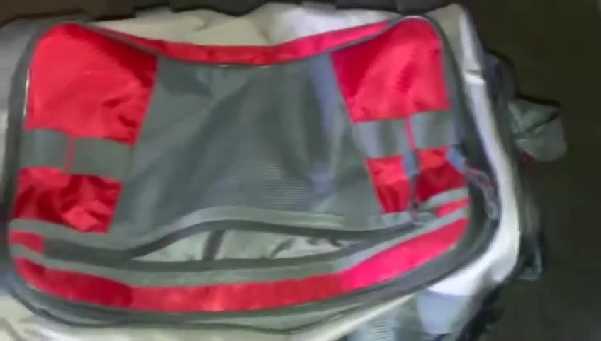 The sunglasses holder on the side of the tackle bag.
