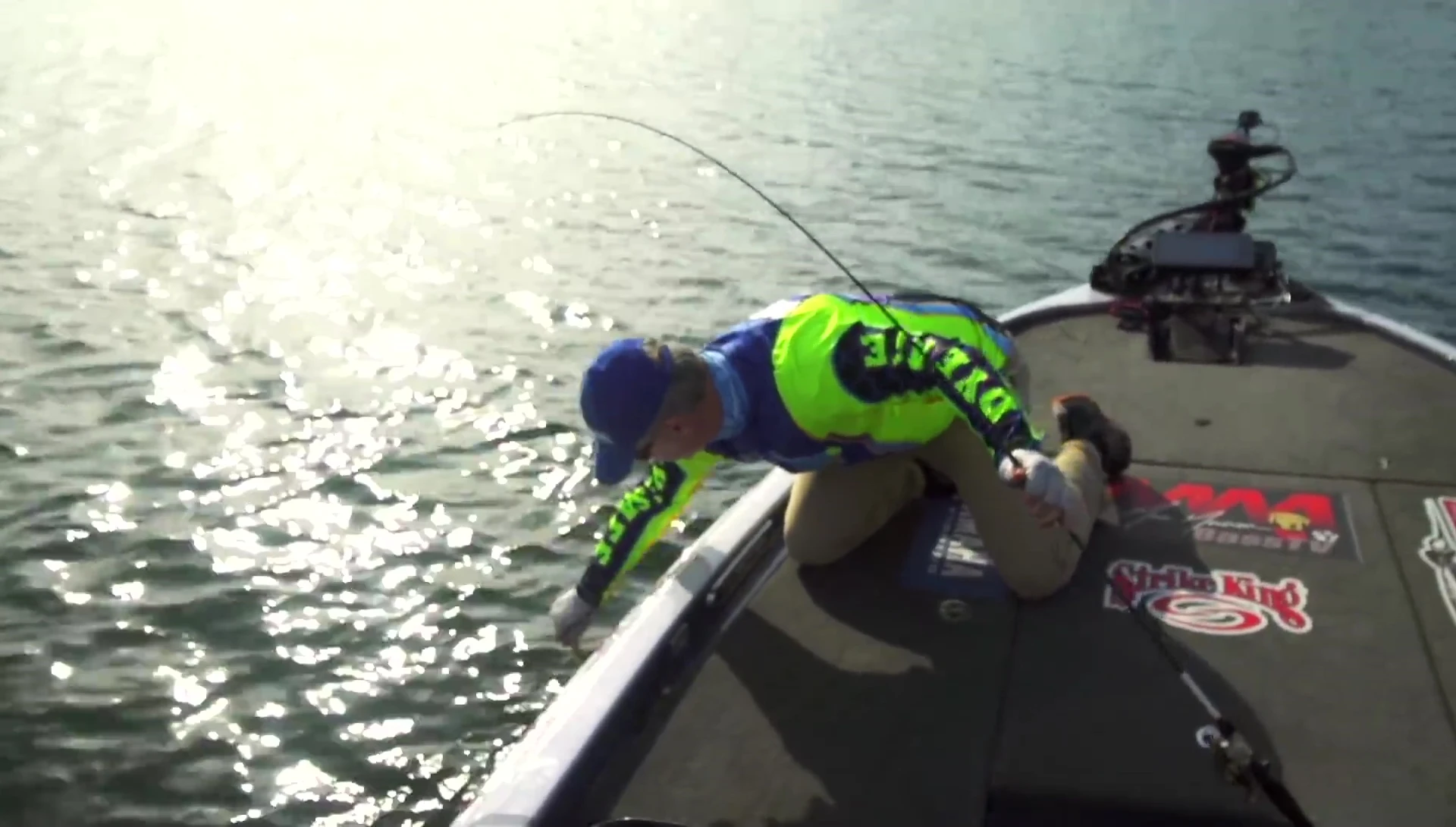 Close-up of the angler holding the KVD jerkbait with a caught fish.