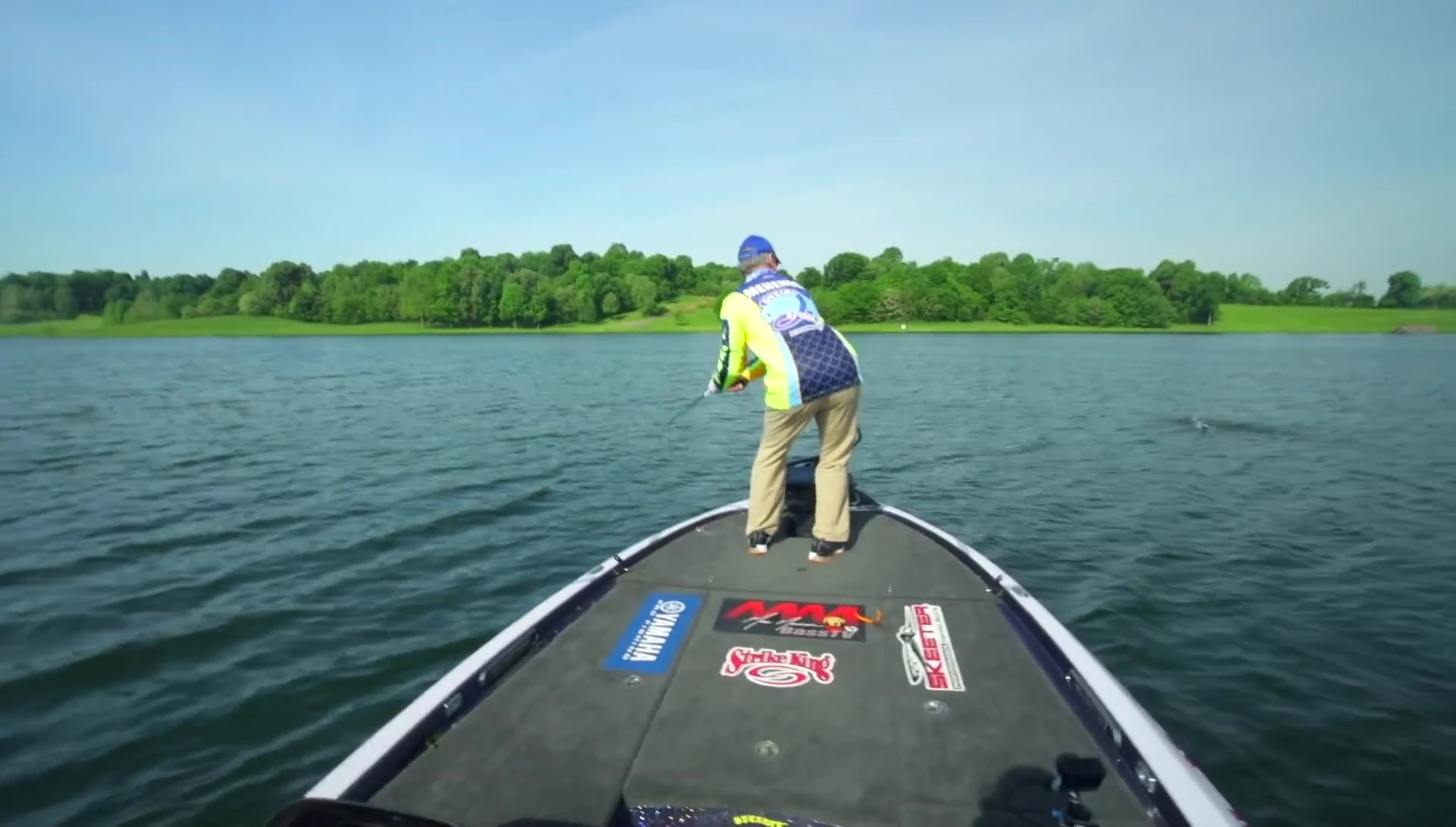 Angler landing a large bass.