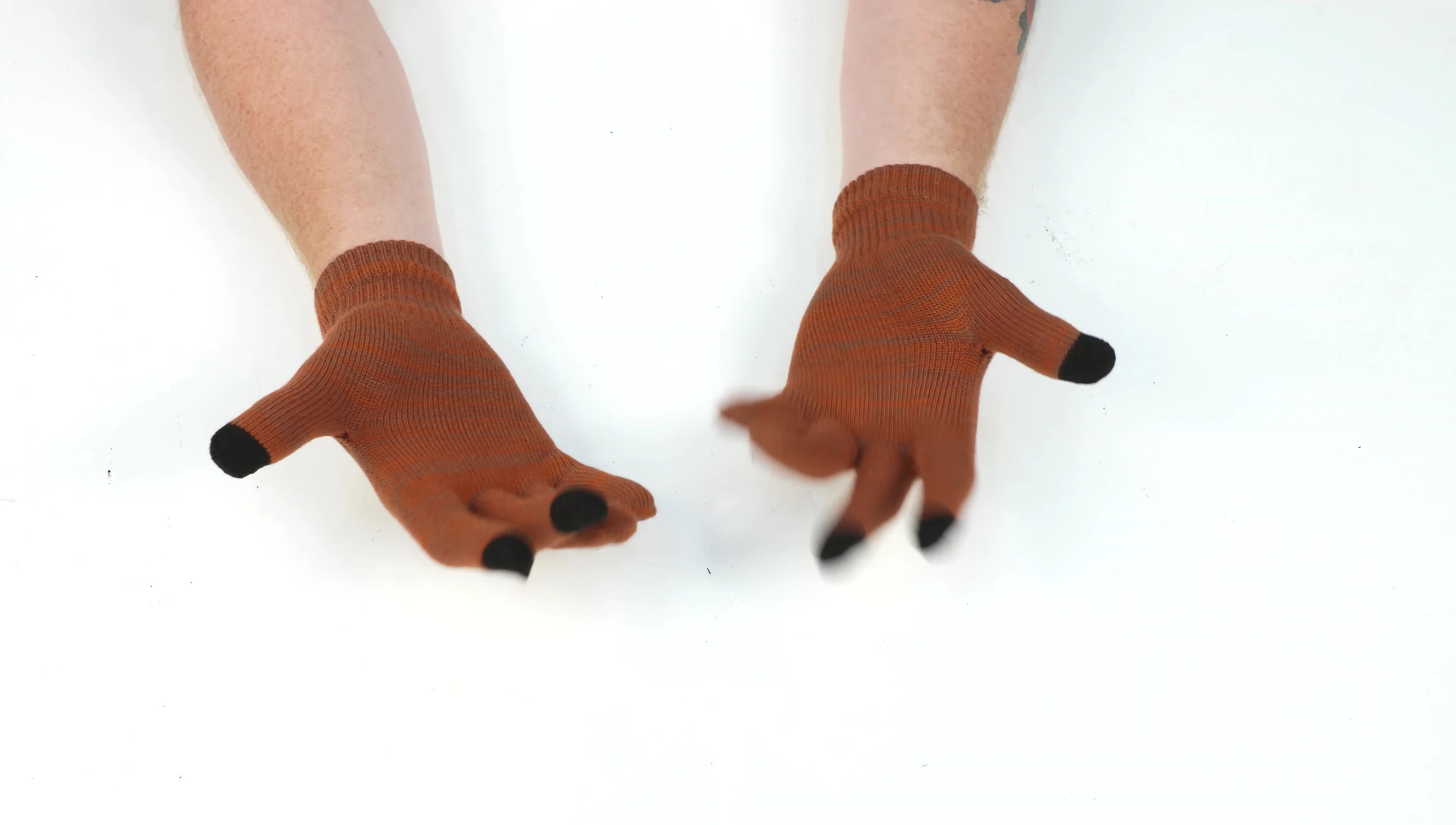 Demonstrating the use of the gloves as a liner.