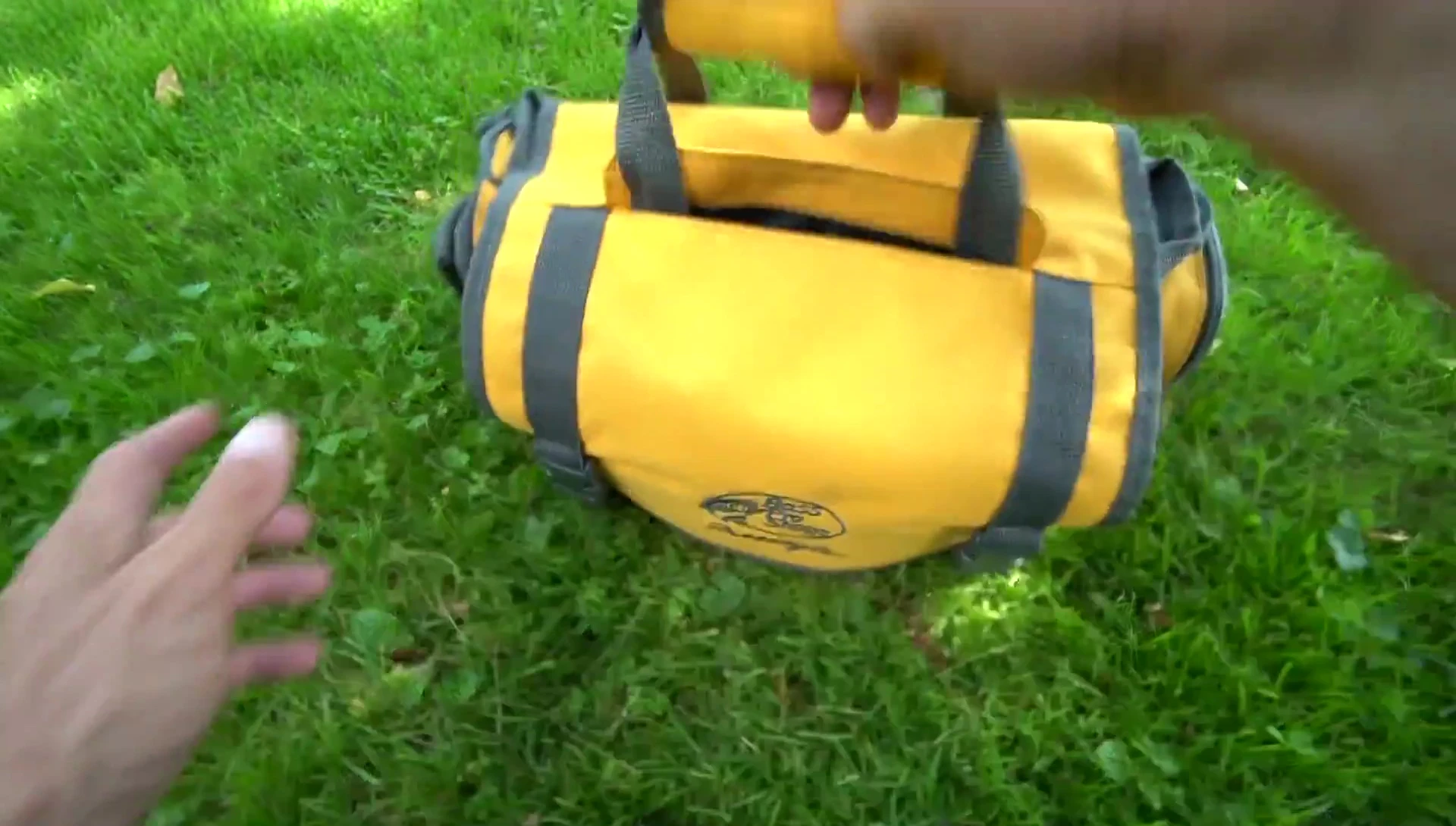 Speaker opening the main compartment of the bag.