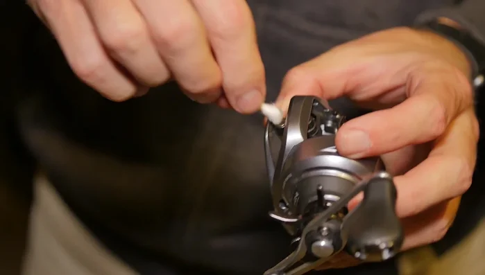 Clean side plates: Use a Q-tip and cleaner (or alcohol) to wipe down the raceways inside the side plates.