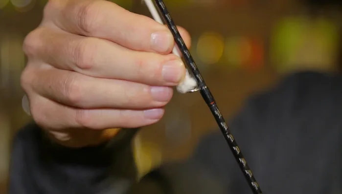 Clean reel seat: Spray and wipe the reel seat area to remove buildup.