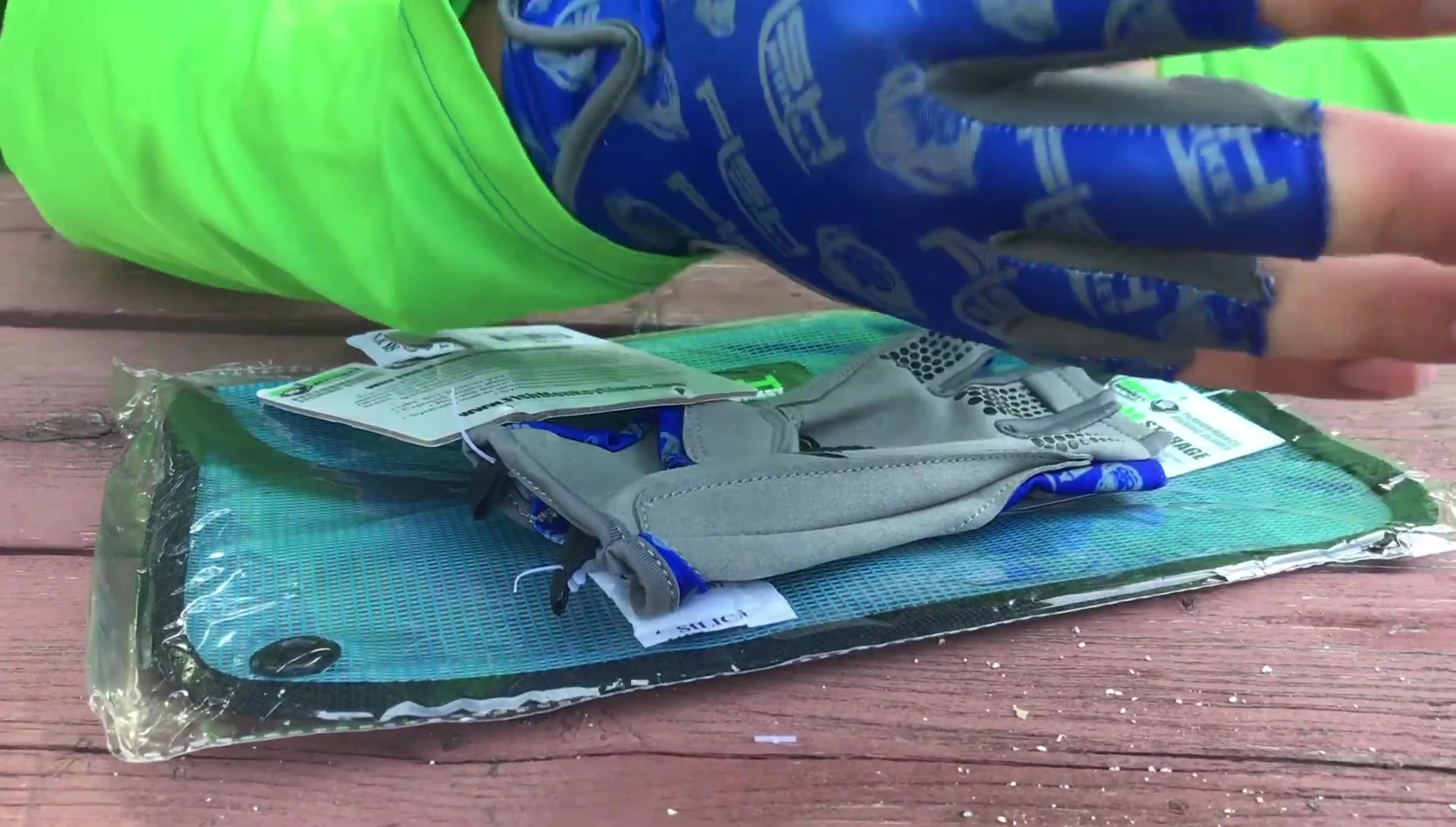 Close-up shot of the presenter putting on the gloves.