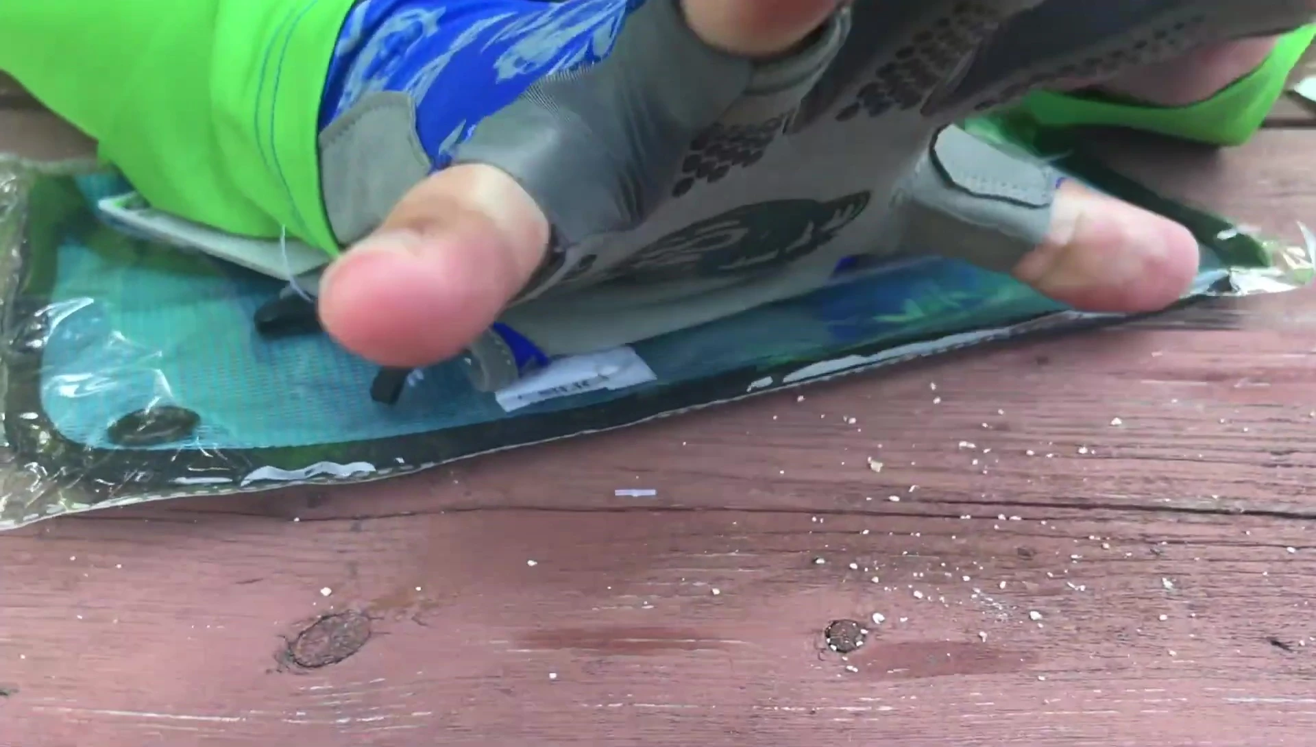 Presenter demonstrating the flexibility and fit of the gloves.