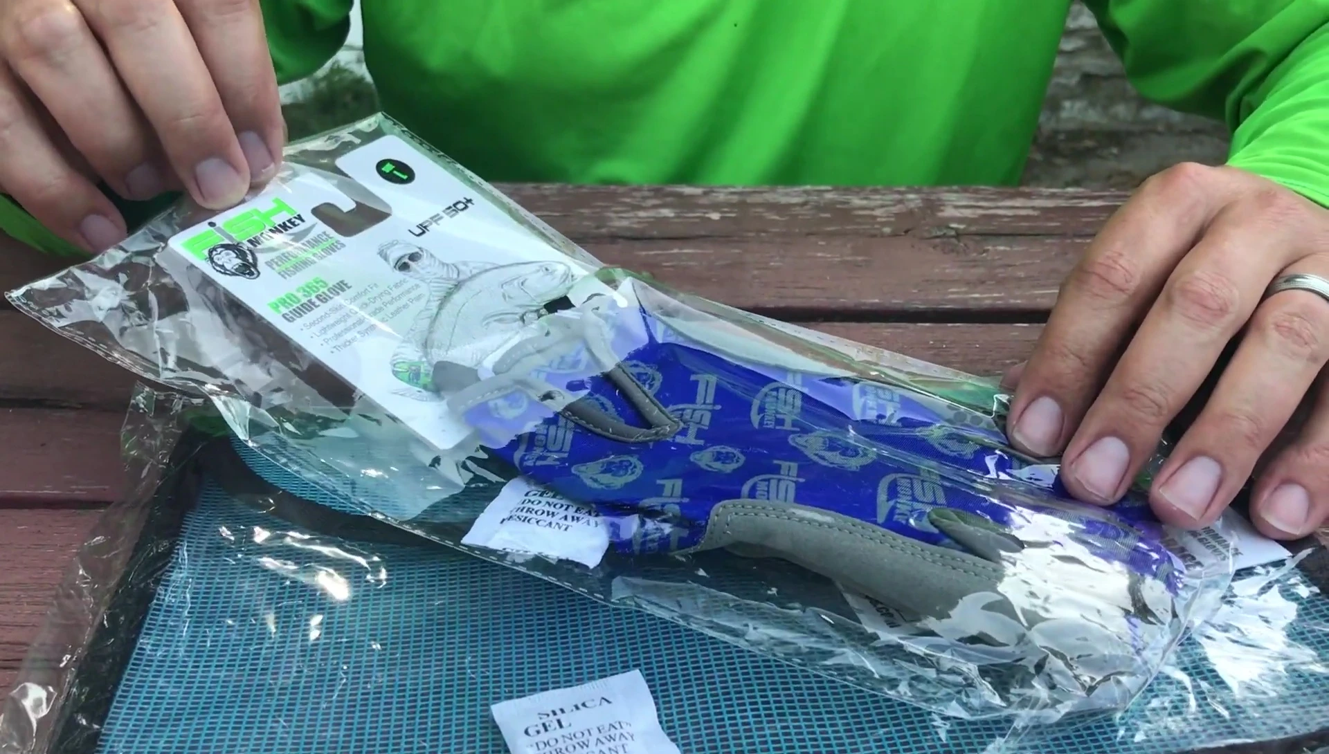 The Fish Monkey Pro 365 Guide Gloves displayed alongside the storage bag.