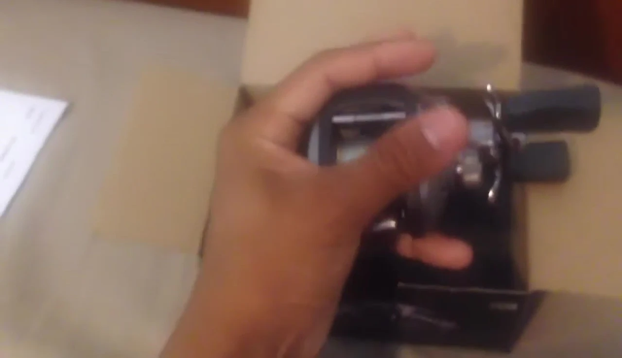The reviewer showing how well the reel fits in his hand.