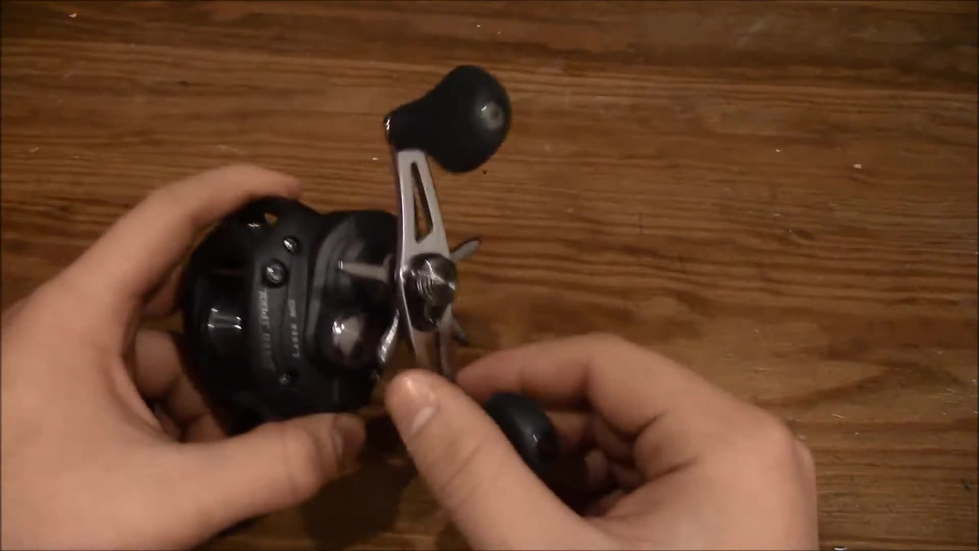 The reviewer demonstrating the reel's retrieve.