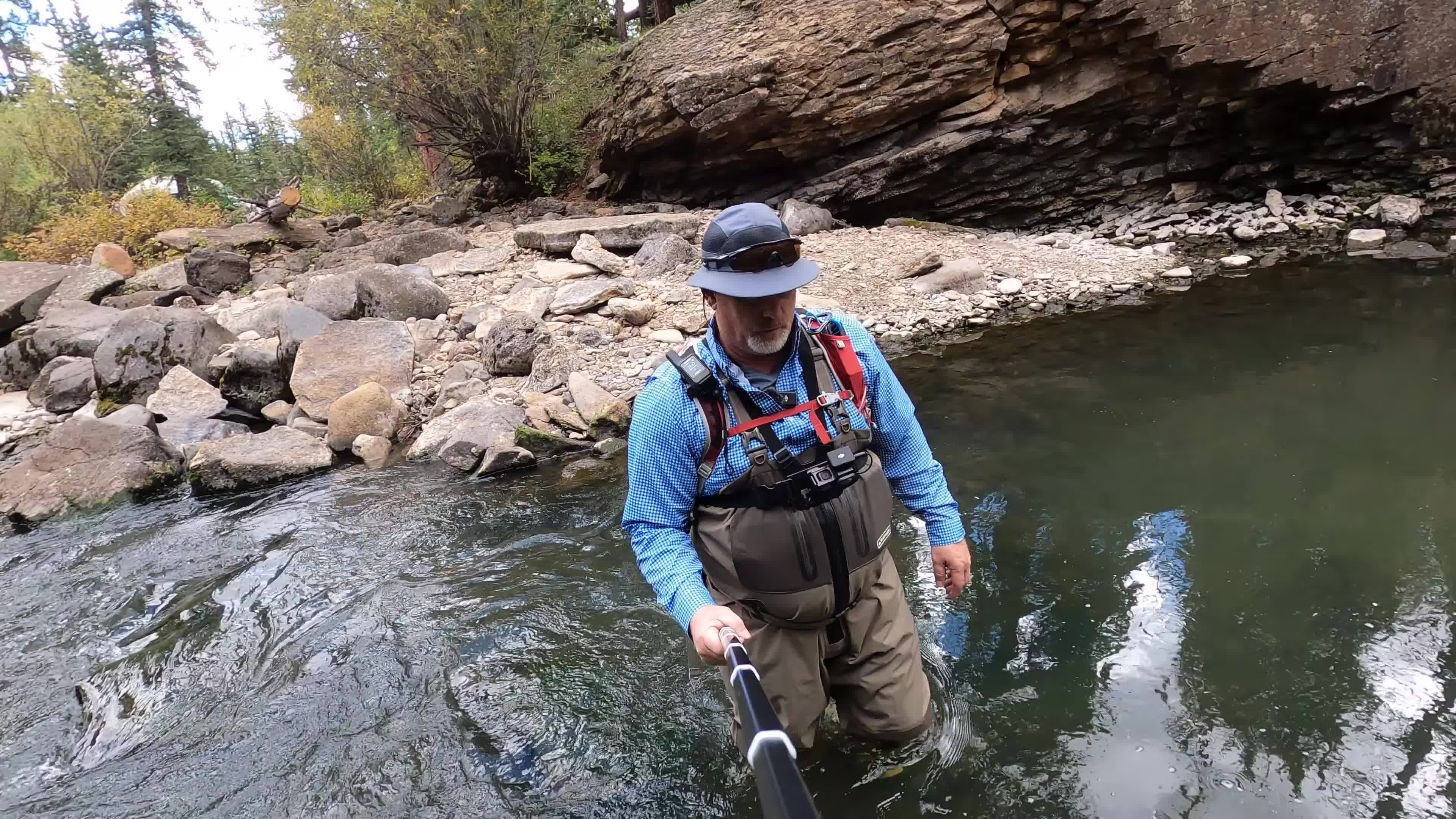 The reviewer walking across the river.