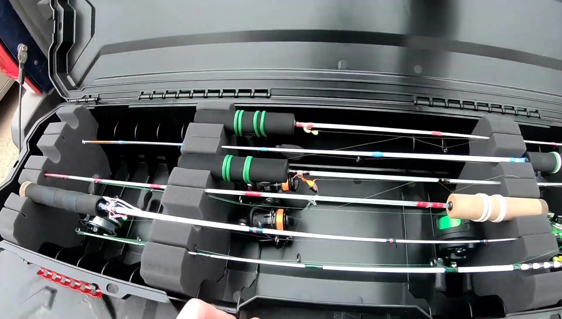 Opening the case to reveal the interior compartments